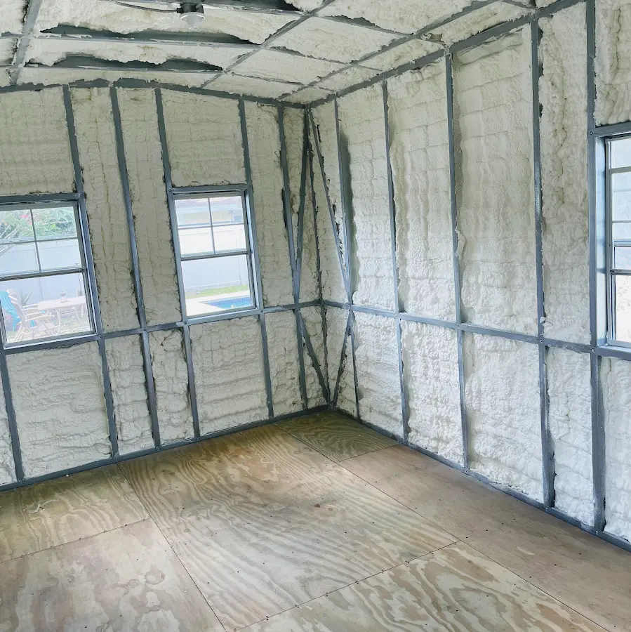 Closed-cell spray foam insulation applied to wall cavities in a residential project in Pulaski